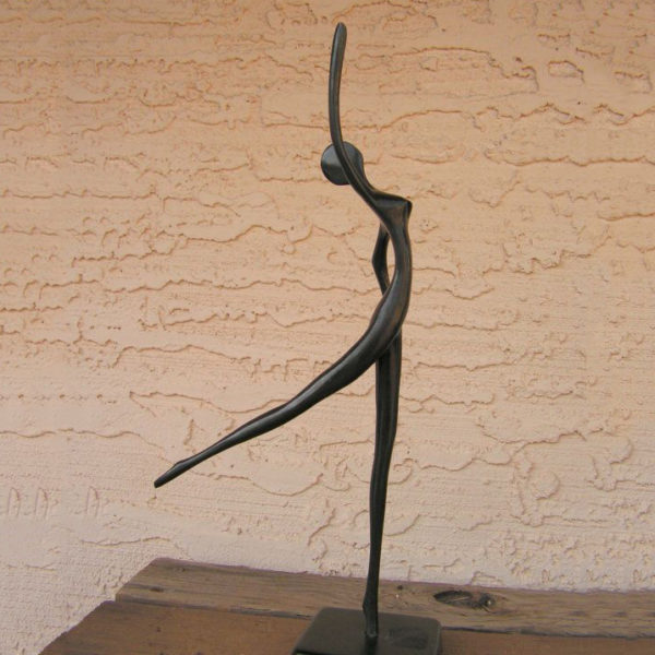 Abstract bronze statue of dancing woman