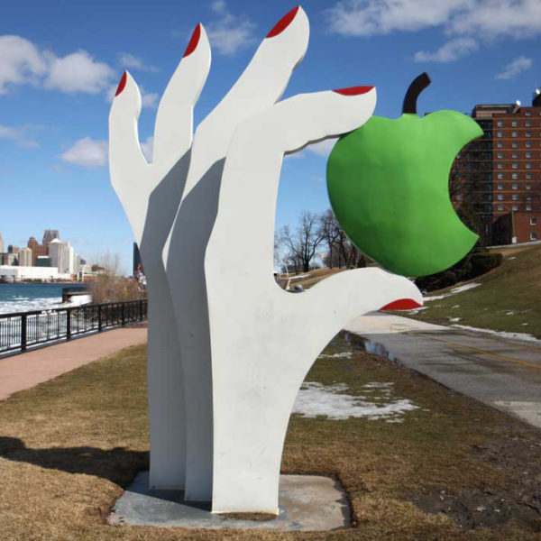 stainless steel hand and apple sculpture